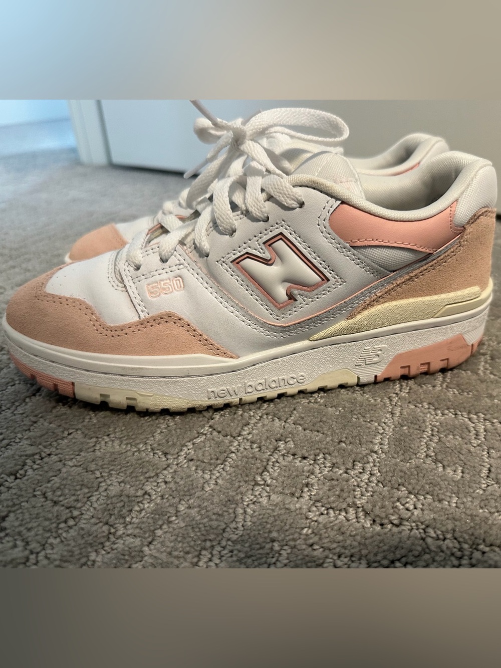New Balance Women’s 550 Sneakers in White and Light Pink